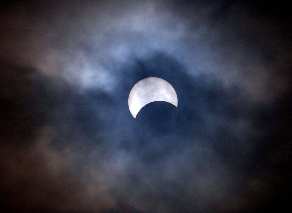 PHILIPPINES SOLAR ECLIPSE (Partial solar eclipse visable on a cloudy morning in Manila)