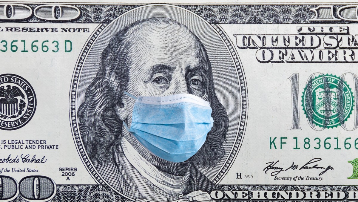 US quarantine, 100 dollar banknote with medical mask. The concept of epidemic and protection against coronavrius.