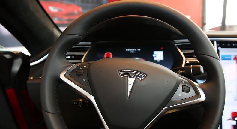 The driver-monitoring system used by Tesla's Autopilot and Full Self-Driving programs can be tricked by attaching weights to the steering wheel, some drivers say.Spencer Platt/Getty Images