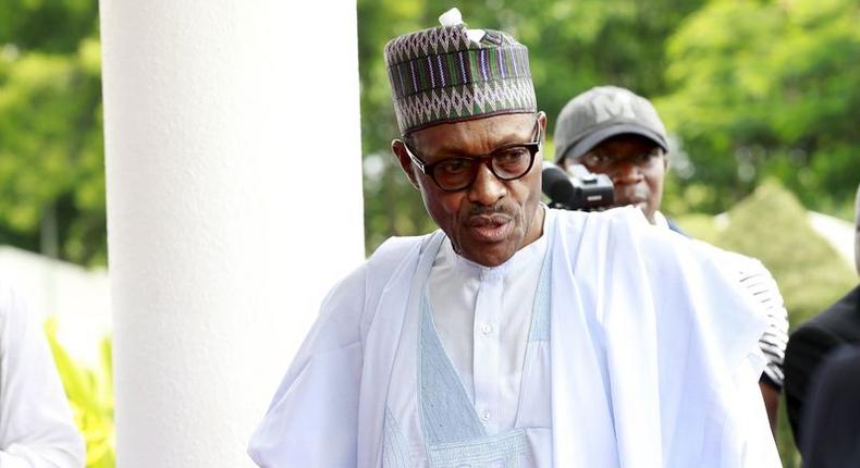 President Muhammadu Buhari says he's committed to increasing the national minimum wage without triggering a fiscal crisis [REUTERS/Afolabi Sotunde]
