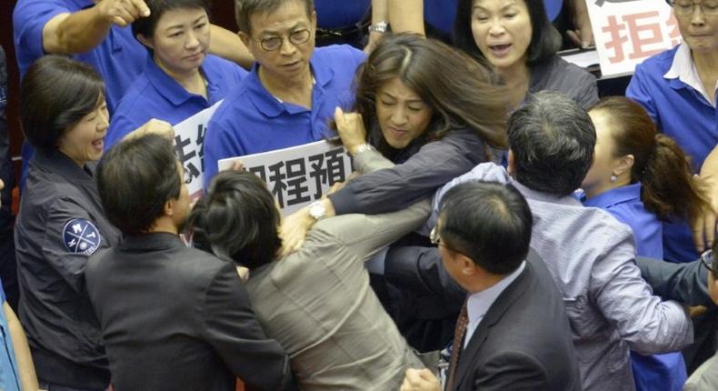 The Taiwan lawmakers' brawl was broken up by about dozen people