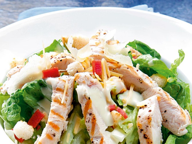 21568_stock-photo-chicken-caesar-salad-on-blue-a-healthy-salad-with-romaine-lettuce-grilled-chicken-breast-shutterstock_6485176