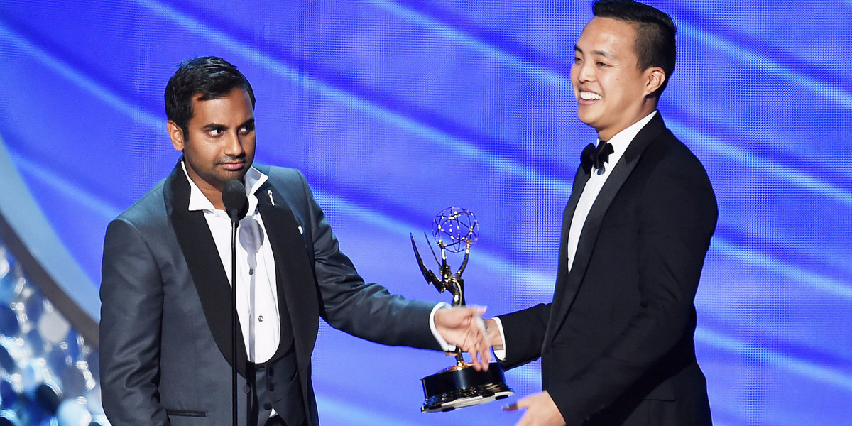 Aziz Ansari, left, and Alan Yang accept their 2016 Emmy for writing on "Master of None."