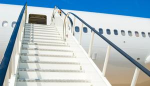 A stock photo of a plane and airstairs.fotoVoyager/Getty Images