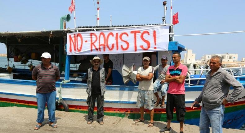 Tunisian fishermen gather on August 6, 2017 in the port of Zarzis in southeastern Tunisia to protest against a possible berthing of the C-Star vessel