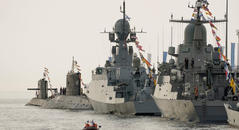 Russian submarines and warships are moored at the St. Petersburg Marine Station closed to receive cruise ships due to the coronavirus pandemic, during the International Maritime Defense show in St. Petersburg, Russia, Friday, June 25, 2021.AP Photo/Dmitri Lovetsky