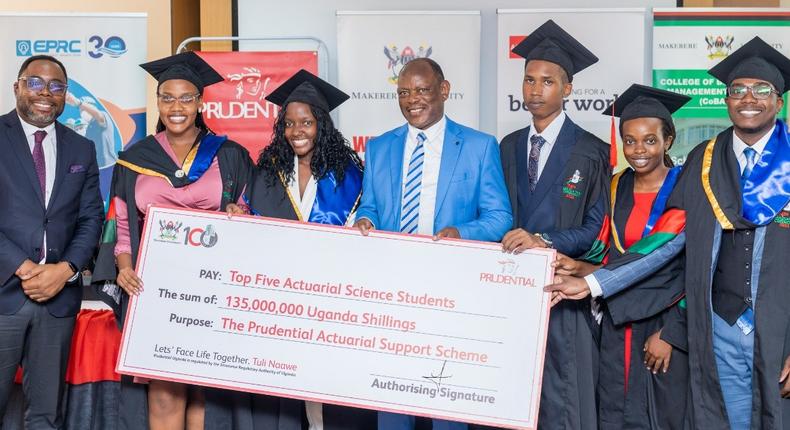 VC Prof Barnabas Nawangwe and Tetteh Ayitevie, the CEO Prudential Assurance Uganda posing with the 2nd cohort graduates