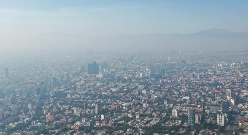 Air pollution in Mexico City. Global CO2 emissions need to drop 45 percent by 2030 and reach 'net zero' by 2050 to limit temperature rises at 1.5 degrees Celsius