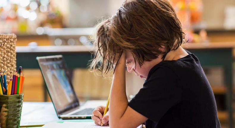 A six-year old going to school virtually — like most students did during the pandemic. The resulting 'learning loss,' will have far reaching economic impacts, according to a National Bureau of Economic Research report.Mint Images/Getty Images