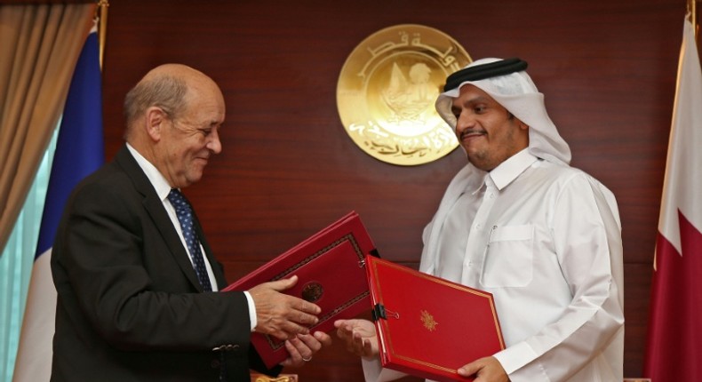 Qatar's Foreign Minister Mohammed bin Abdulrahman Al-Thani (R) met with his French counterpart Jean-Yves Le Drian in Doha to sign the strategic dialogue agreement on February 11, 2019