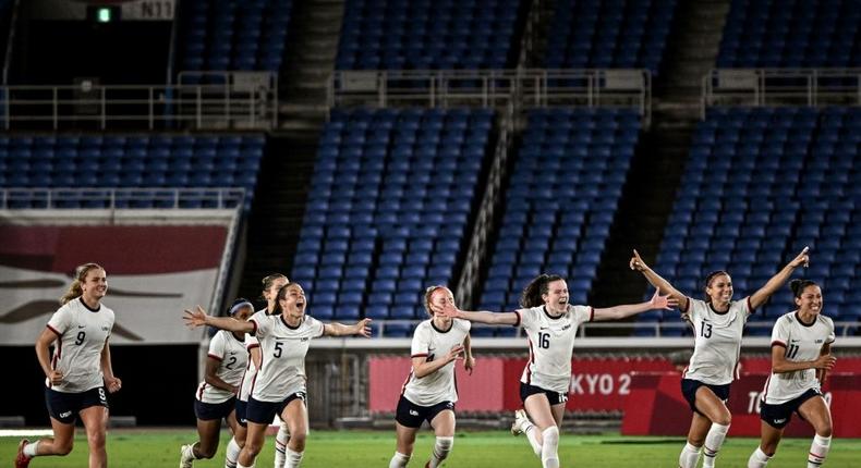 United States players celebrate after beating the Dutch on penalties Creator: JEFF PACHOUD