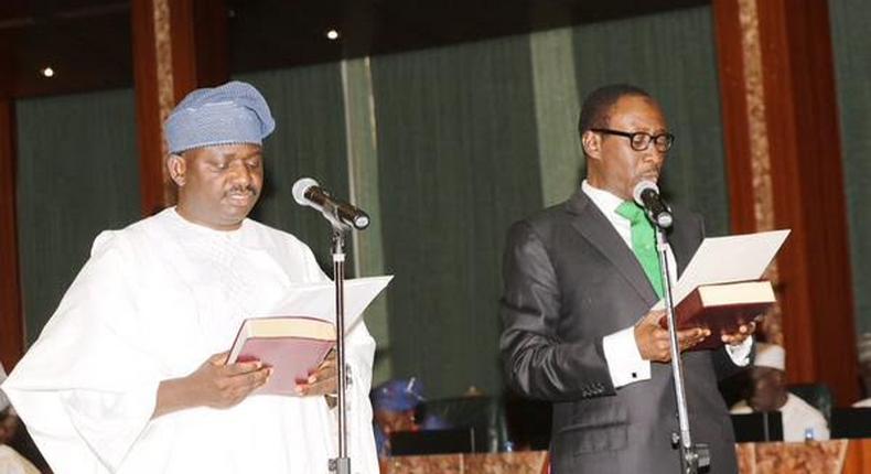 Femi Adesina (left) being sworn in as the President’s Special Adviser on Media and Publicity.