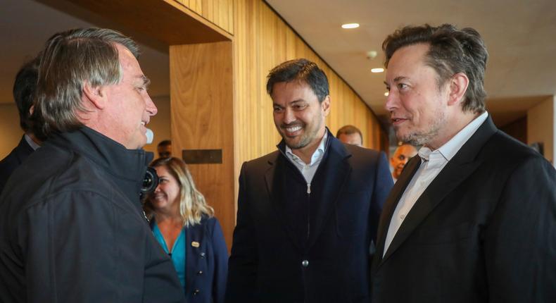 Musk met with Bolsonaro (left) on Friday to discuss projects in the Amazon rainforest.