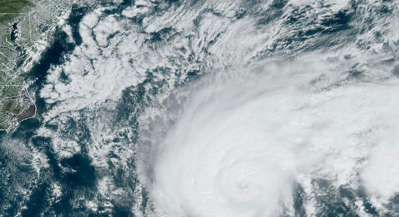 Humberto moves off the US east coast in the Atlantic Ocean on September 18 in this satellite image obtained from NOAA/RAMMB