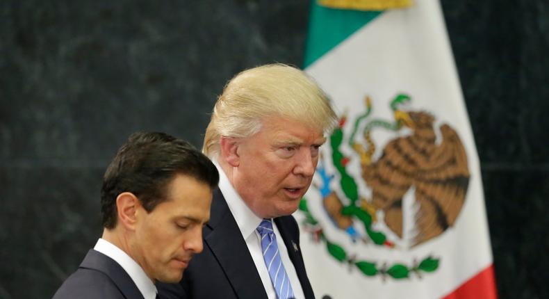 Donald Trump and Mexico's President Enrique Pena Nieto arrive for a press conference at the Los Pinos residence in Mexico City.