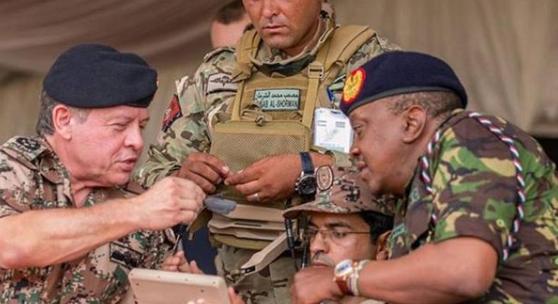 President Uhuru Kenyatta with Kenya Defence Forces soldiers. Kenyatta says KDF will not withdraw from Somalia