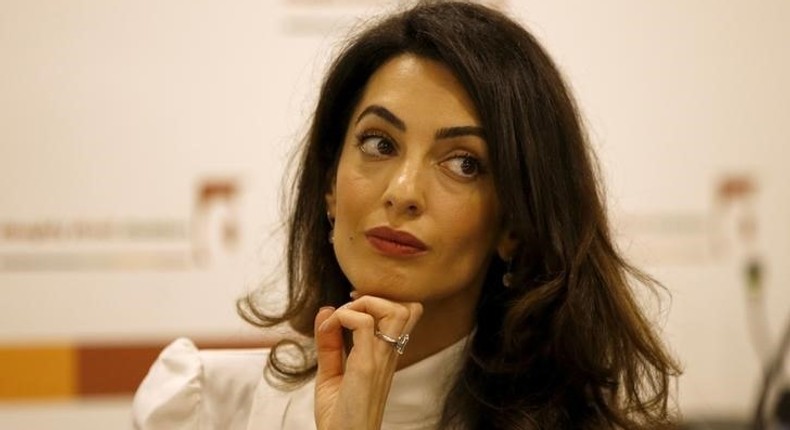 Lawyer Amal Clooney listens during a news conference for Mohamed Nasheed, in central London, Britain October 5, 2015. REUTERS/Peter Nicholls