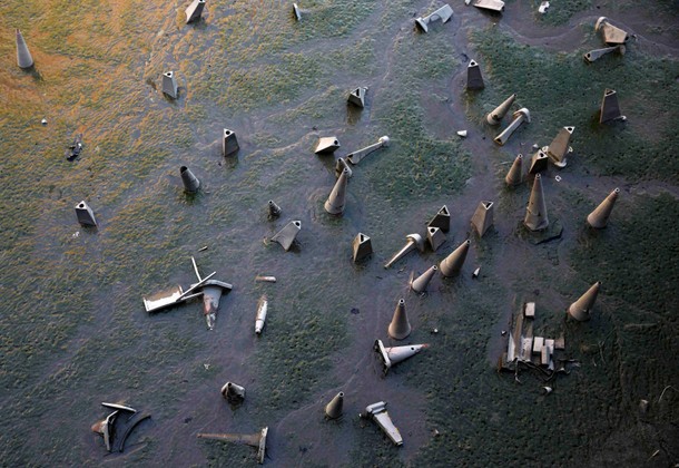 Traffic cones are seen on the bank of the River Thames during low tide in London,