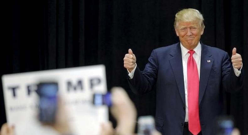 Trump holds lead in New Hampshire, rebuked for profanity by Bushes