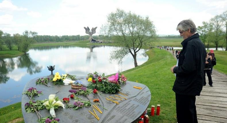 A man looks at the World War II Jasenovac memorial camp model on April 26, 2015, during a ceremony to remember the tens of thousands who were killed by the country's pro-Nazi regime