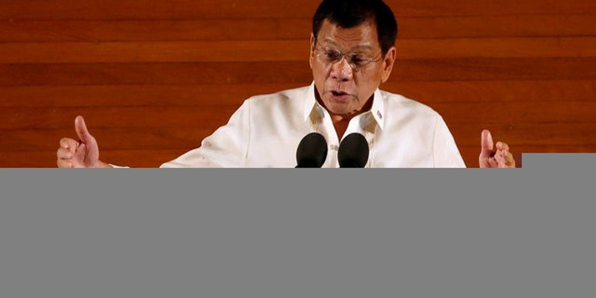 Philippine President Rodrigo Duterte gestures during his first State of the Nation Address at the Philippine Congress in Quezon city, Metro Manila