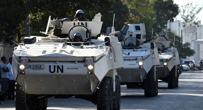 The UN Stabilization Mission in Haiti (MINUSTAH), which will shut down after 13 years, passes an opposition protest in Port-au-Prince in February 2016