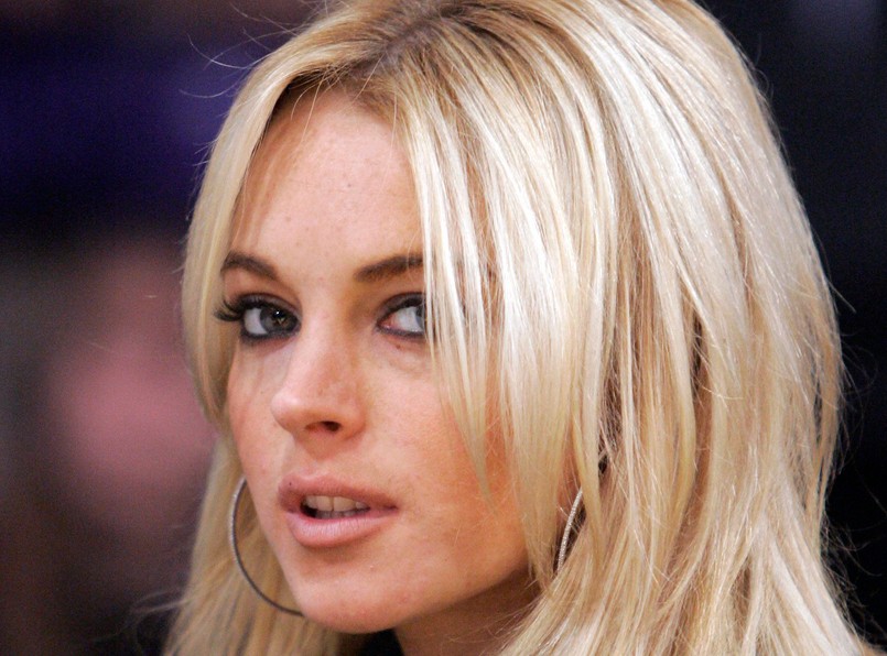 ** FILE ** Actress Lindsay Lohan is seen at the Los Angeles Lakers game against the Orlando Magic in their NBA basketball game, in this Dec. 2, 2007, file photo in Los Angeles. Court papers filed Tuesday, Dec. 4, 2007, allege the busboy who sued Lindsay Lohan has proof the actress had been drinking before she collided with his van in October 2005. Raymundo Ortega contends that Lohan drove her Mercedes-Benz into a van he was driving after she drank alcohol and later tried to escape paparazzi. He is seeking $200,000 in damages.  (AP Photo/Mark J. Terrill, file)