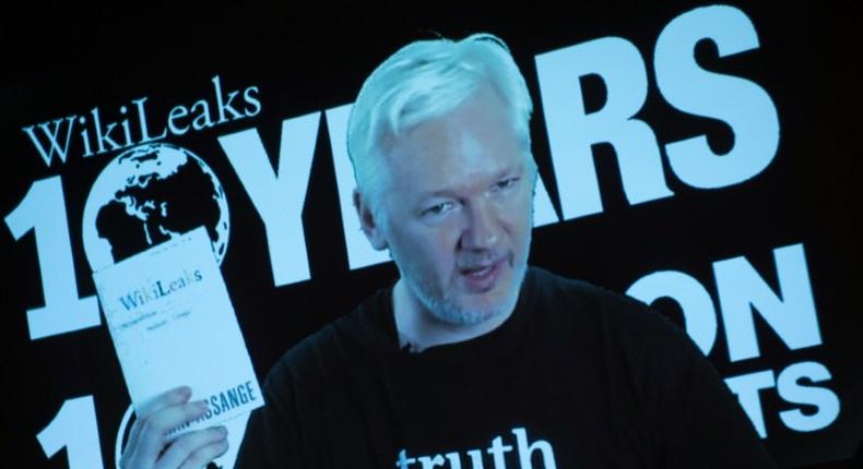 Julian Assange, founder of the online leaking platform WikiLeaks, addresses journalists via a live video connection during a press conference on the platform's 10th anniversary