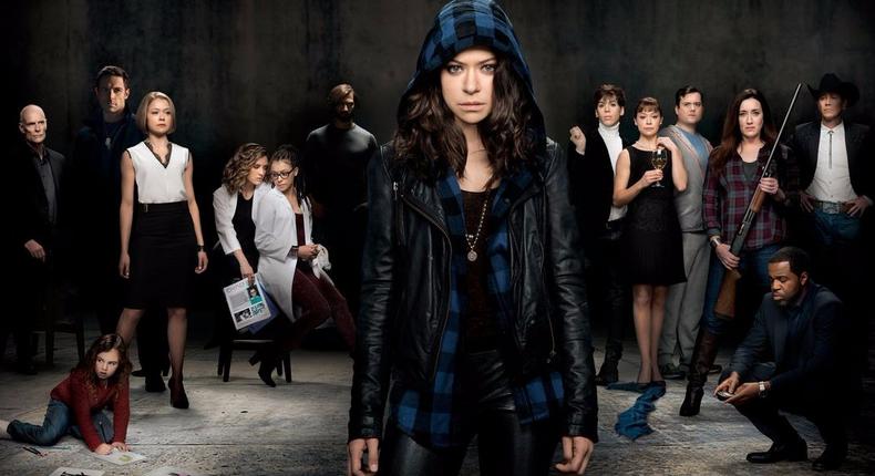 Orphan Black star Tatiana Maslany stands in front of many of the show's clones.