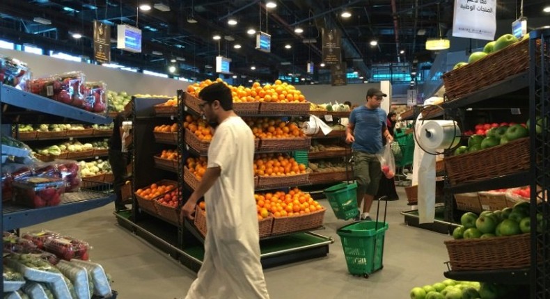 Customers are seen shopping at the al-Meera market in the Qatari capital Doha, on June 10, 2017. Saudi Arabia, Egypt, the UAE and Bahrain announced on June 5 they were cutting diplomatic ties and closing air, sea and land links with Qatar