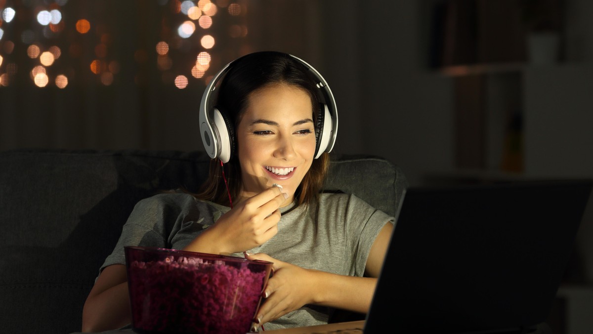 Woman watching online tv in the night