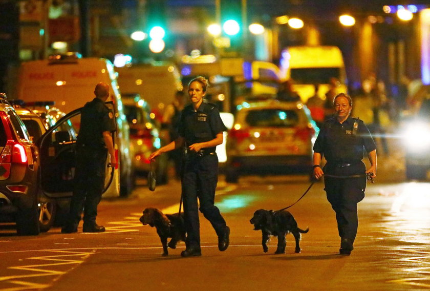 A man prays after a vehicle collided with pedestrians near a mosque in the Finsbury Park neighborhoo