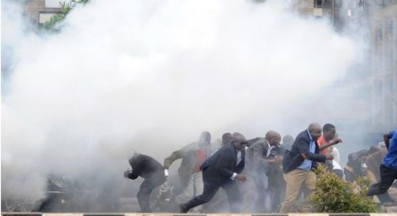 File image of police using teargas canisters to disperse rowdy crowds at a past political event. Police moved in swiftly to disperse rowdy youths who attempted to disrupt a Team Embrace ally in Garissa on Saturday