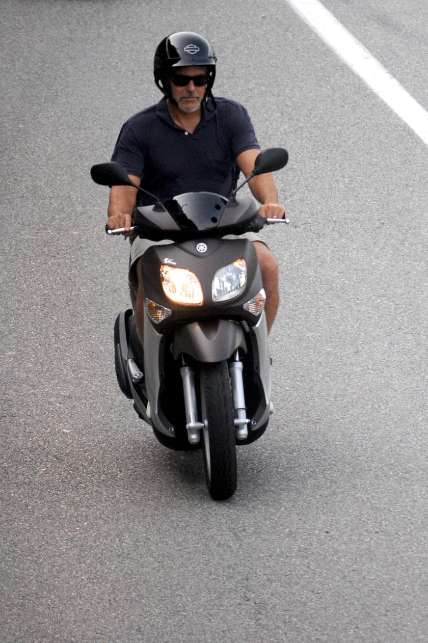 EXCLUSIVE: George Clooney takes a relaxing scooter ride around Lake Como, leaving wife Amal at home 