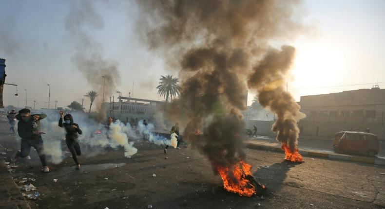 Anti-government protesters tried Monday to block central Baghdad streets with burning tyres