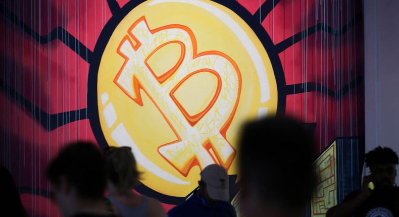A banner (designed by artists Stacey Coon, Anastasia Sultzer, and Nanu Berks) with the logo of bitcoin is seen during the crypto-currency conference Bitcoin 2021 Convention at the Mana Convention Center in Miami, Florida, on June 4, 2021