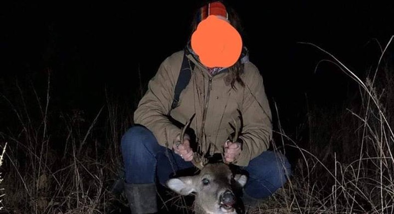 A woman accused of killing a deer in an illegal hunting poses with her prize. - FacebookOklahoma Game Wardens