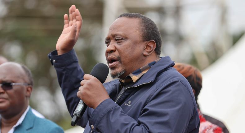 Retired President Uhuru Kenyatta addresses a roadside gathering on August 6, 2022 after a one-day working tour of the Central region where he inspected and commissioned several development projects in Murang'a and Nyeri counties