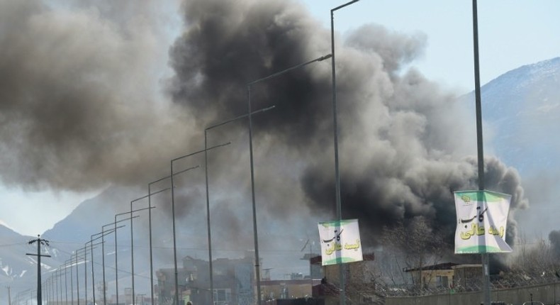 Smoke rises from an Afghan police headquarters building in Kabul after a suicide car bombing on March 1, 2017