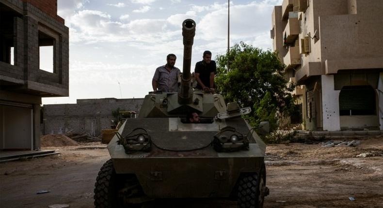 Misrata's fighters are pictured on a tank during clashes against Islamic State group in Sirte, Libya, on September 21, 2016