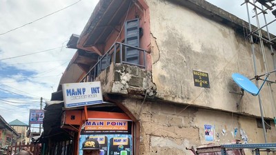 One of the distressed structures marked for demolition in Alaba Market.