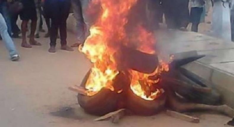 Angry mob burn man accused of stabbing neighbour to death