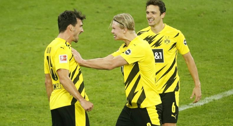 Dortmund striker Erling Braut Haaland (C) is out until January with a torn muscle, but defender Mats Hummels (L) says his ankle injury is not serious
