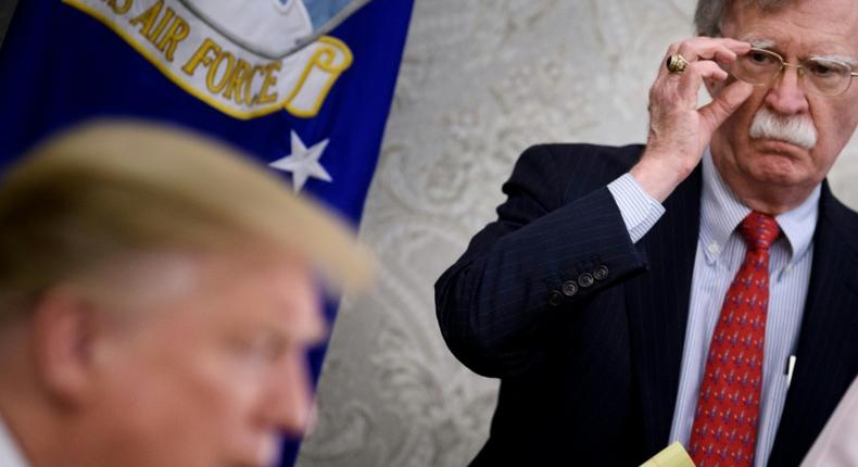 National security advisor John Bolton, considered a hawk on Iran, listens to President Donald Trump at the White House in May 2019