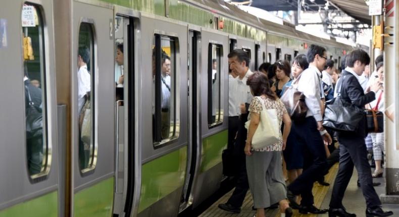 The scene at a Tokyo train station as Japan launches an exercise to encourage commuters to work from home in the run-up to the summer Olympics in 2020