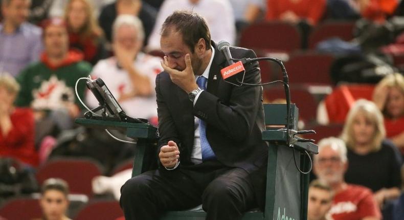 Tennis umpire Arnaud Gabas was taken to hospital after he was hit in the face with a ball hit by Denis Shapovalov during a Davis Cup tie between Canada and Great Britain in Ottawa