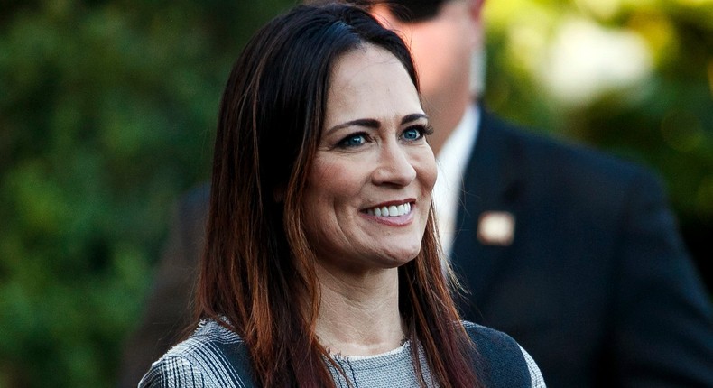 In this June 21, 2019 photo, Stephanie Grisham, spokeswoman for first lady Melania Trump, watches as President Donald Trump and the first lady greet attendees during the annual Congressional Picnic on the South Lawn in Washington. First lady Melania Trump has announced that Grisham will be the new White House press secretary. Grisham, who has been with President Donald Trump since 2015, will also take on the role of White House communications director. (AP Photo/Jacquelyn Martin)