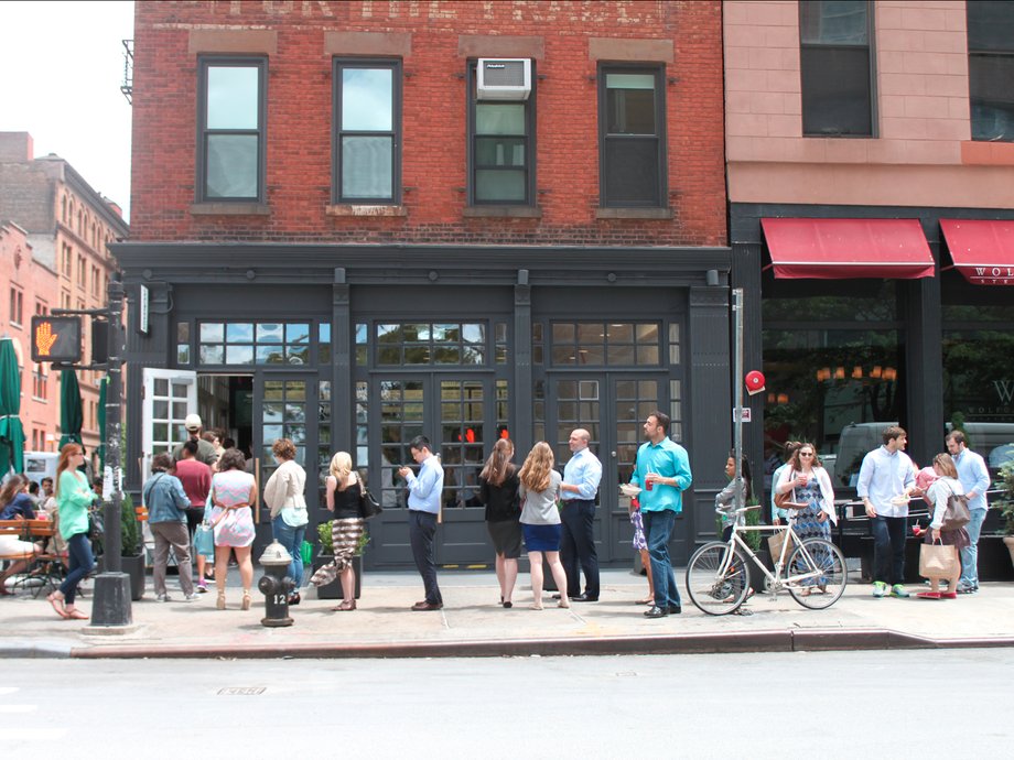 People wait on long lines to get into Sweetgreen.