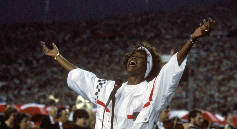 Whitney Houston sings the national anthem prior to the Super Bowl.