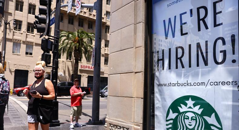 A 'We're Hiring!' sign is displayed at a Starbucks on Hollywood Boulevard on June 23, 2021 in Los Angeles, California.Mario Tama/Getty Images